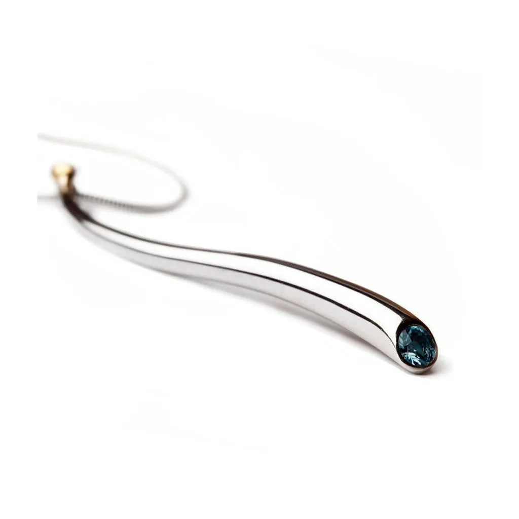 Curving silver wiggly pendant with blue topaz & 18K gold detail