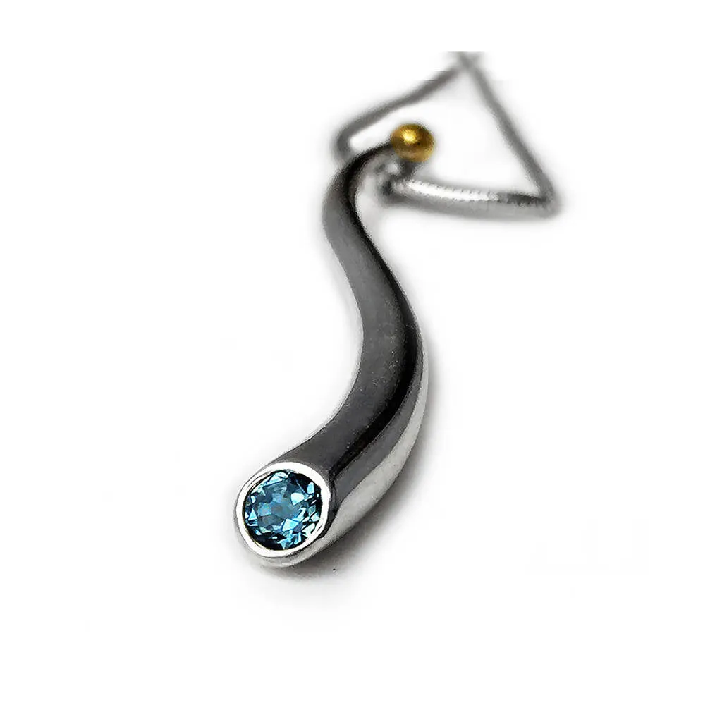 Curving silver wiggly pendant with blue topaz & 18K gold detail